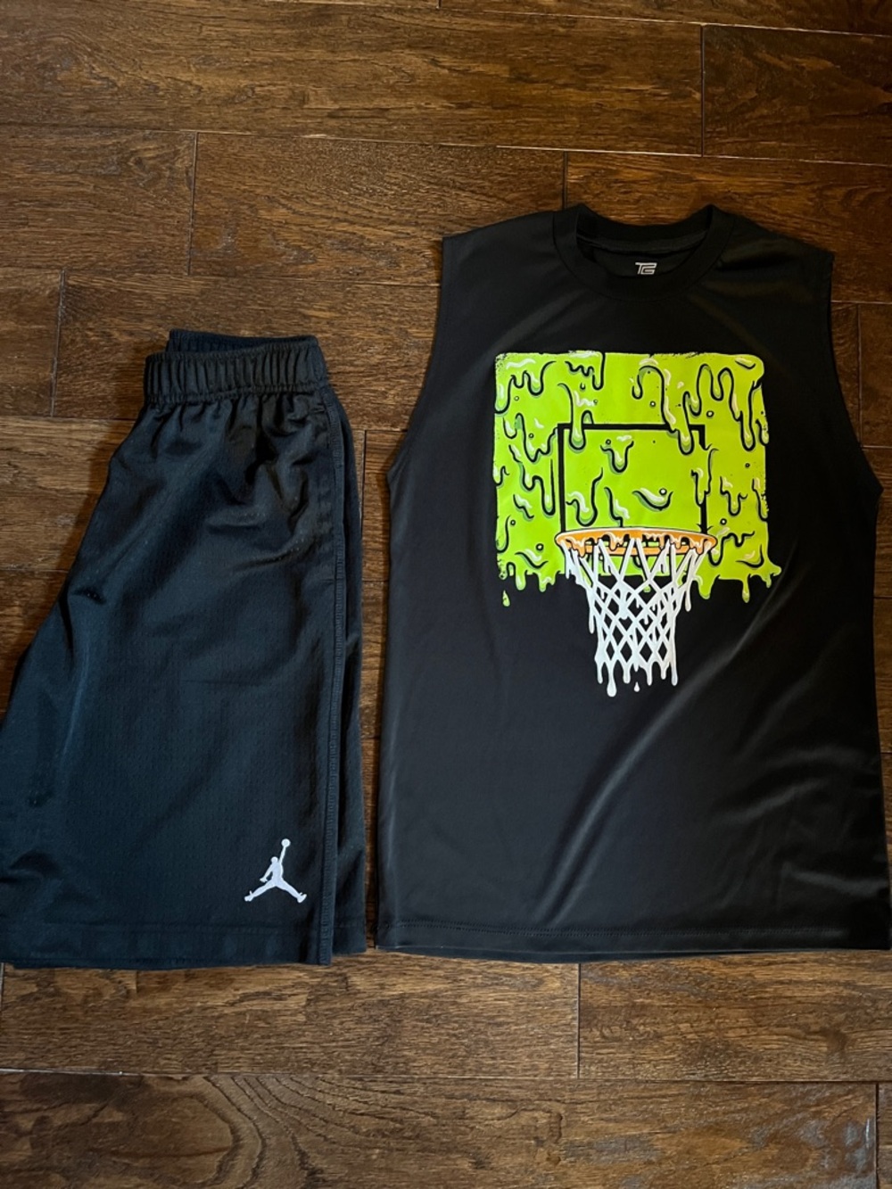 Boys black NBA shorts and sleeveless basketball t-shirt.  Sized medium.